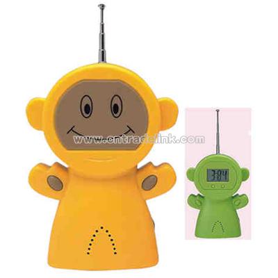 Auto scan FM radio with clock in shape of alien with smiling face