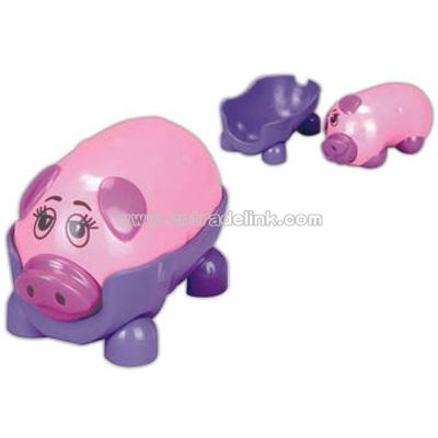 Battery operated pig shaped massager with its own stand