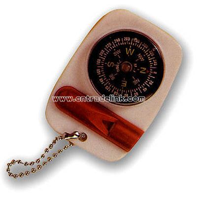Beige key tag with red whistle and compass