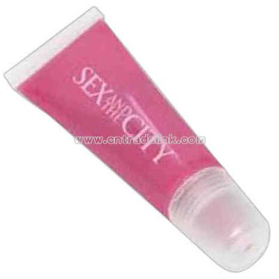 Berry flavored pink lip gloss in a clear tube