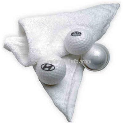 Compressed small 100% cotton golf towel in golf ball case
