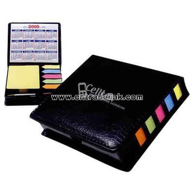 Leather look case of sticky notes with calendar and pen
