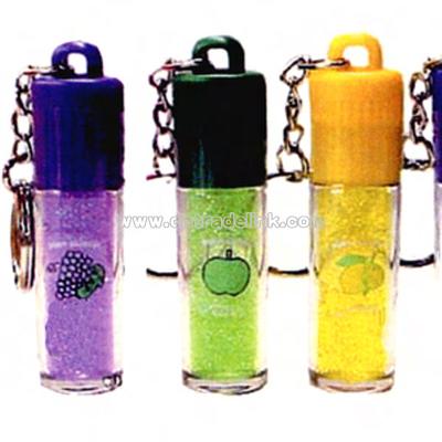 Lip gloss in assorted flavors with metal key chain