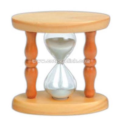 Natural oval shape sand timer with white sand.