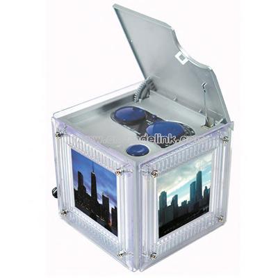 Photo cube AM/FM radio that features a three-sided photo frame