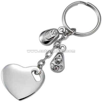 Silver heart key ring with charms.
