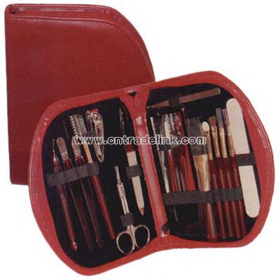 Women's red simulated leather cosmetic kit with manicure and makeup sets