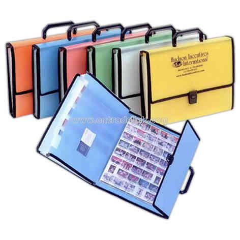 Expanding file with sewn edge, swing handle and black buckle closure.