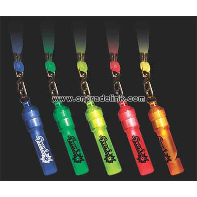 Flashing whistle with breakaway lanyard