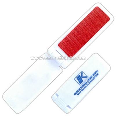 Folding lint brush with shoe horn