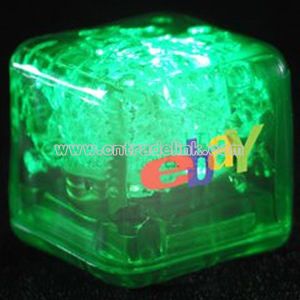 Green liquid flahsing ice cube