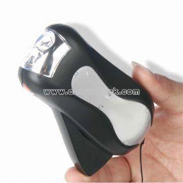 Hand pressing Dynamo Flashlight