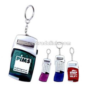 Key ring with calculator and translucent flip cover