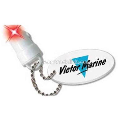 Light up floatable keychain with water activated red LED