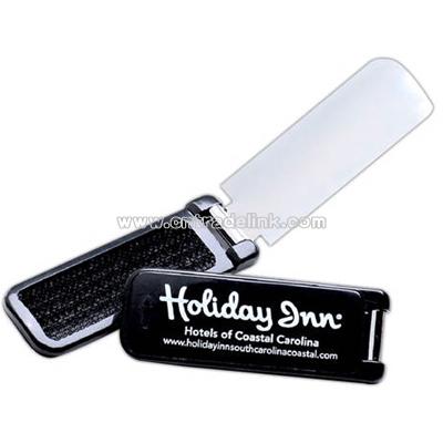 Lint brush with shoe horn