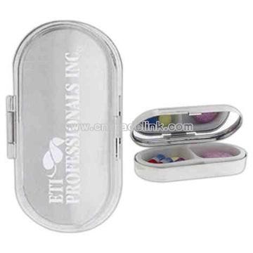 Metal pill case with two plastic compartments
