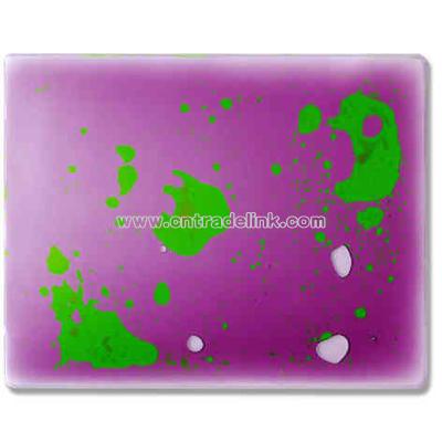 Mouse pad filled with purple and green liquid