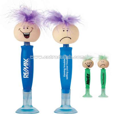 Novelty pen with suction cup cap and funny head at top of pen with two faces.