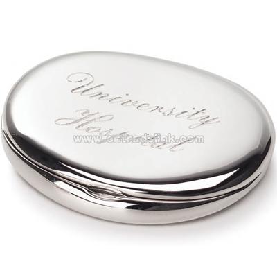 Oval compact mirror with one side magnified and the other side regular