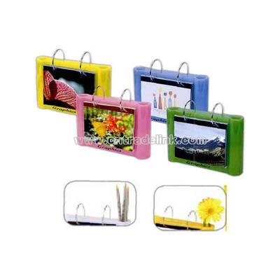 Photo frame with pen and pencil holder