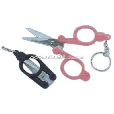 Pocket size key chain with folding scissors