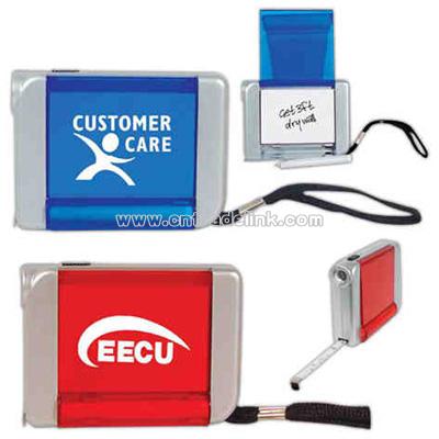 Six foot tape measure with light, pad, and pen.