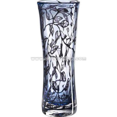 Trailing plants float gently through vase