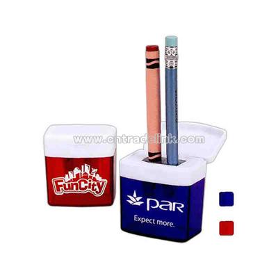 Translucent crayon and pencil sharpener with white top