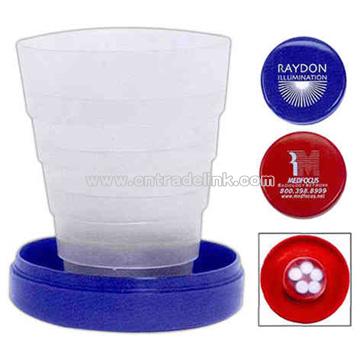 Travel cup with pill holder and plastic cover in lid