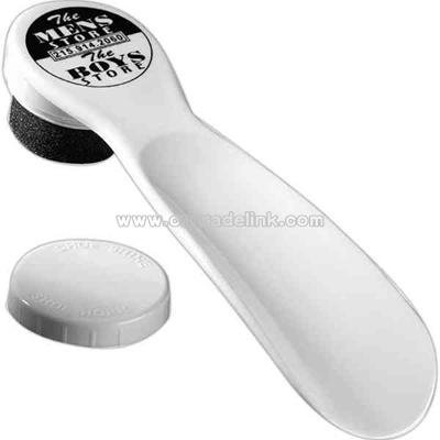 White shoe horn with built in shoe polisher